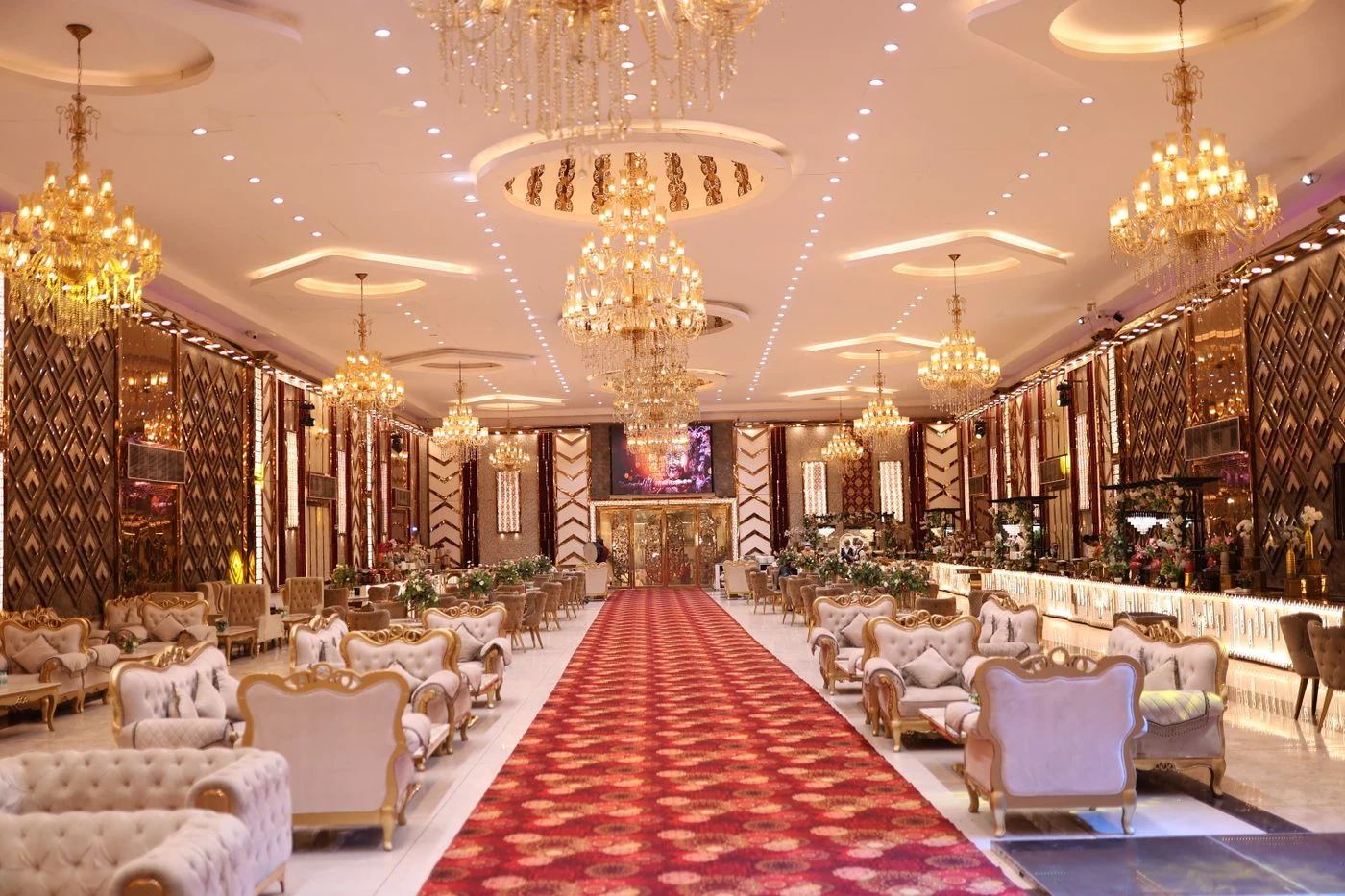A high-end wedding venue with crystal chandeliers, gilded interiors and a grand reception hall