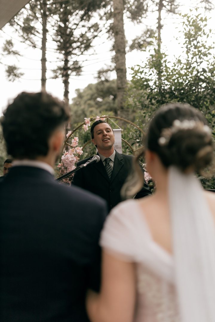 beautiful outdoor wedding ceremony with officiant Licensed inspiration image; not a BMG client portfolio claim.